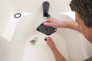 Plumber--Unclogging-Bathtub-Drain-000019365922_Large