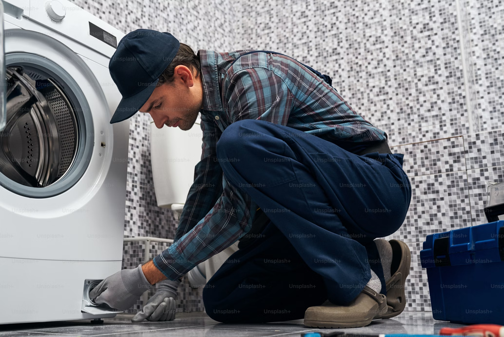 Man fixing washing machine